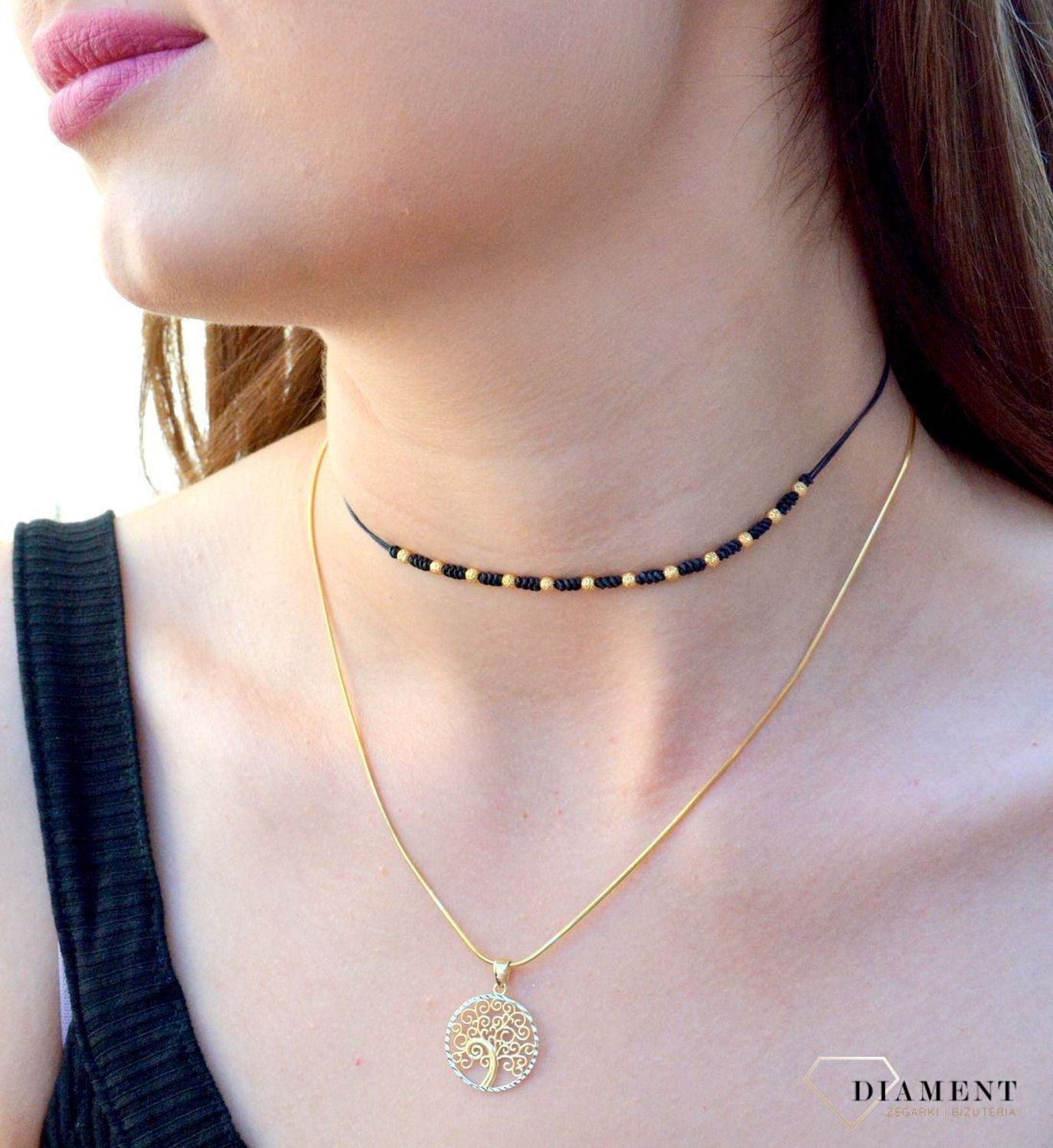 Złota zawieszka 'Drzewko szczęścia z białym złotem' ZA 4653 333. Nowoczesna zawieszka złota zawieszka drzewko szczęścia z białym złotem, w którym znajduje się kształt drzewka, które zostało ozdobione.jpg